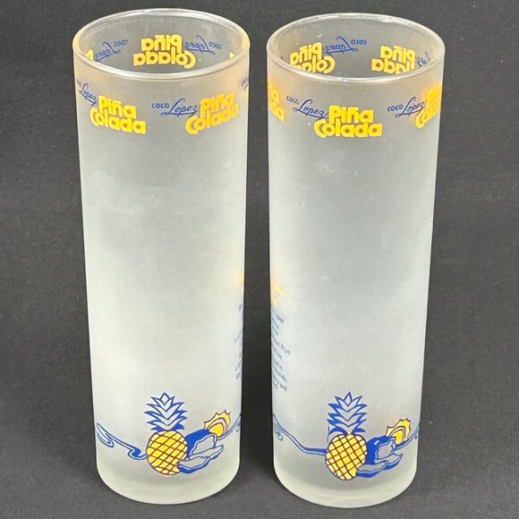 2 tall frosted drink glasses. Coco Lopez Pina Calada - Picture 1 of 4